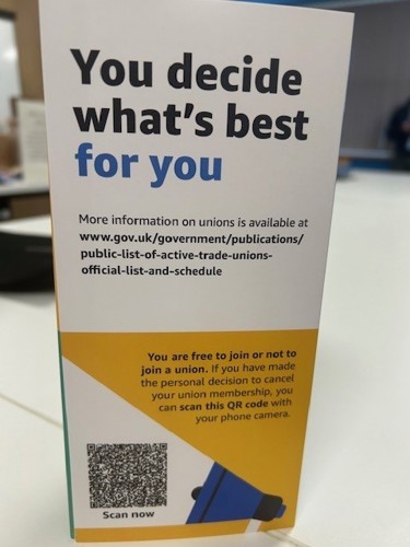 A printed card titled 'You decide what's best for you', with link to a government site and QR code by some text