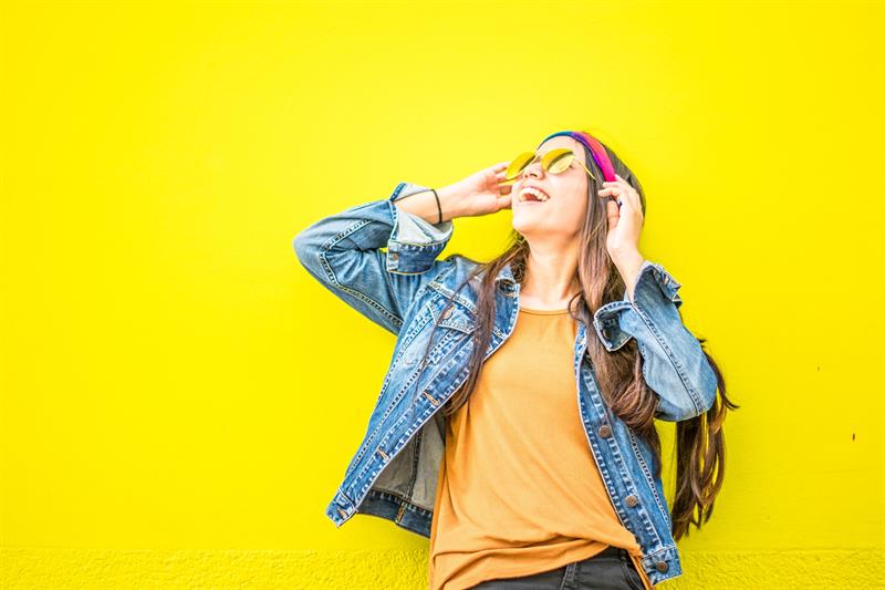 article-images%2F226676%2Fsmiling-woman-looking-upright-standing-against-yellow-wall-1536619.jpg